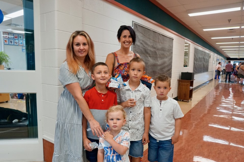 Yuliya Kurylenko, left, brought her son Nicholas Akinchets (Grade 2) to school, accompanied by younger sibling Adam. Natalia Dobrianska had two sons – Daniel Dobrianskiy (Grade 2) and David Dobrianskiy (kindergarten) getting ready for the new year at St. Mary's.                                