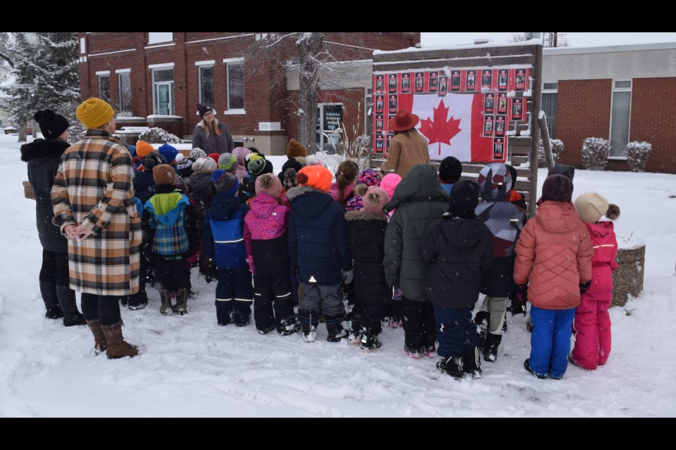Along with their teachers, a group of Grade 1 and 2 students listened attentively on Nov. 8 as Brandi Zavislak, community development officer, explained the importance of the banners along Canora streets.