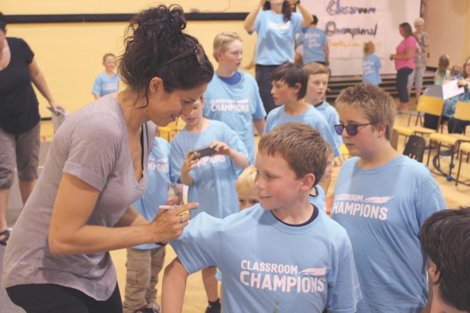 Para-snowboarder Michelle Salt signed the shirt of student Donald Alexander at Queen Elizabeth School, at the windup for the Classroom Champions program in June of 2018. The program will be in Weyburn classrooms this year as well.