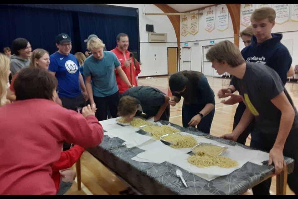 CCS students enthusiastically took part in a number of Halloween-themed games leading up to the big day, including a race involving the very tricky task of finding four gummies in a container full of spaghetti using only their mouths.