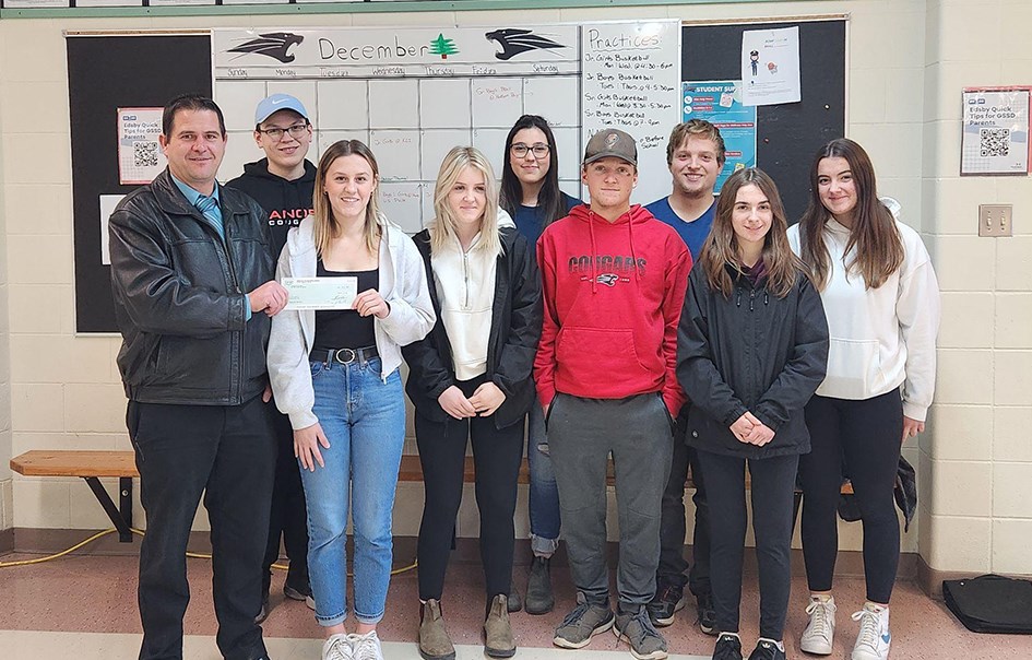 EuroTrip members posing for a photo following the history-making Co-op Card sale, from left, were: Brad Chambers (Gateway Co-op General Manager), Josh Rock, Makayla Heshka, Jordan Harper, Bailee Zuravloff, Kayden Harder, Brandon Harder, Callie Berehula and Ava Love.