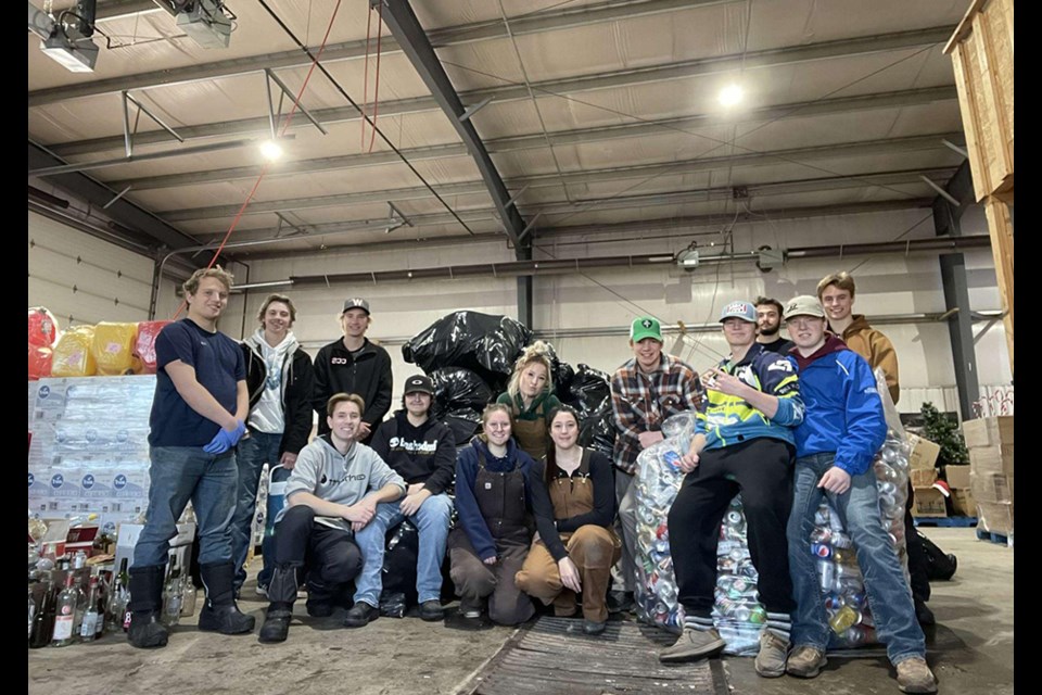 The 2024 CCS Grads posed for a photo after the bottle drive fundraiser. From left, are: (back row) Brandon Harder, Lucas Latham, Nate Wolos, Shayna Leson, Bronson Heshka, Michael Owchar and Jack Craig; and (front) Brayden Goetzinger, Ethan Curtis, Callie Sznerch, Bailee Zuravloff, Rylan Bletsky and Porter Wolkowski.