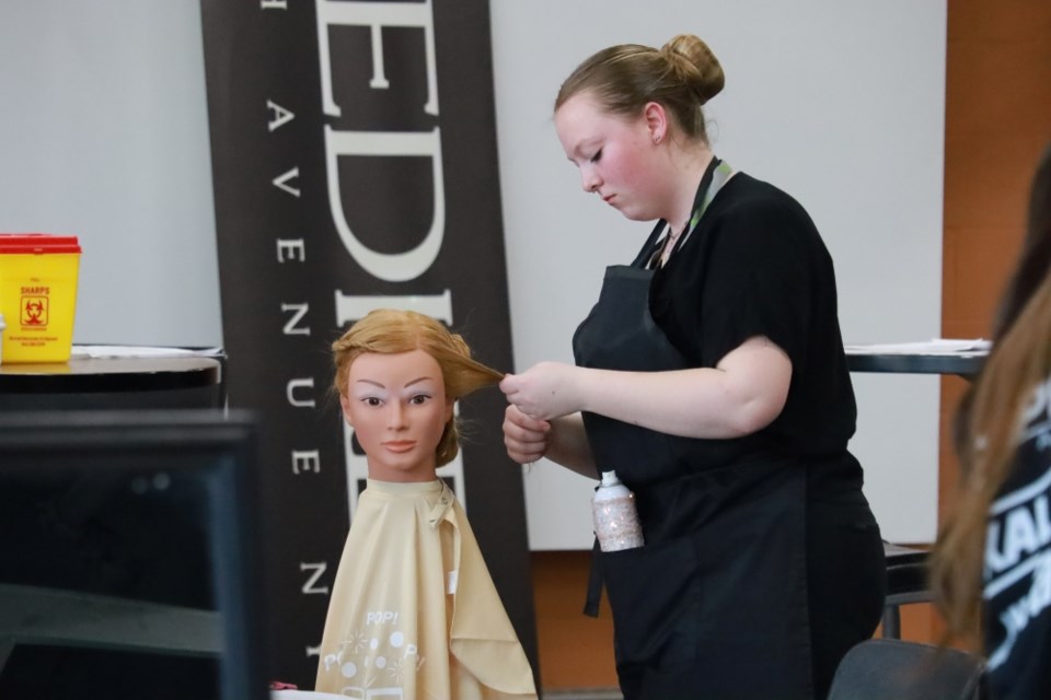 Alyssa Saccary won a bronze medal in bridal hairstyling.