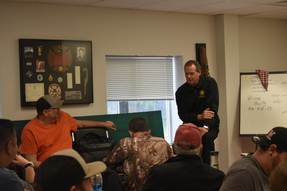 Reid Wharton discussed various hypothetical chemical and hazardous scenarios with the firefighters, educating them on the most effective and safe ways to assess and act on said scenarios. This included reminding them that most radioactive hazards are not as dangerous as they may seem due to the packaging and safety measures in place when handling radioactive materials.
