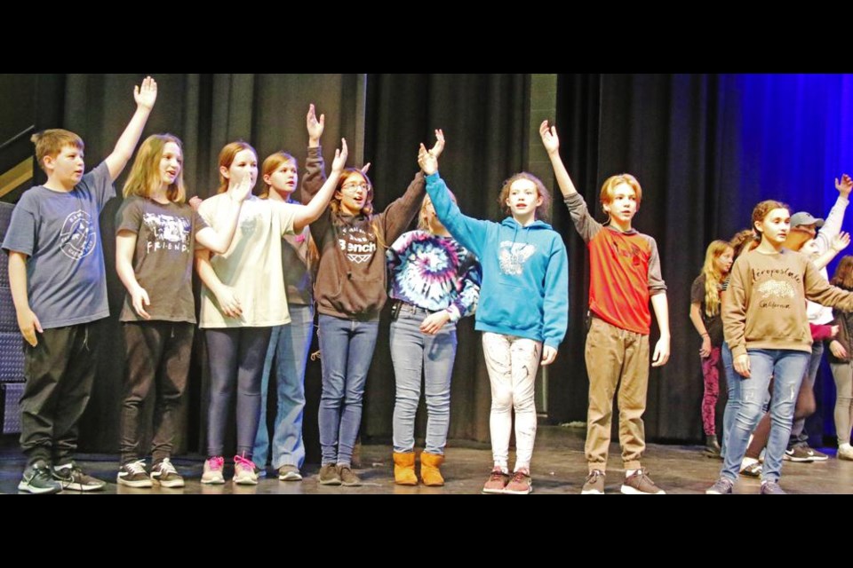Chorus members sang at a recent rehearsal for the stage musical of Frozen Jr. at the Cugnet Centre.