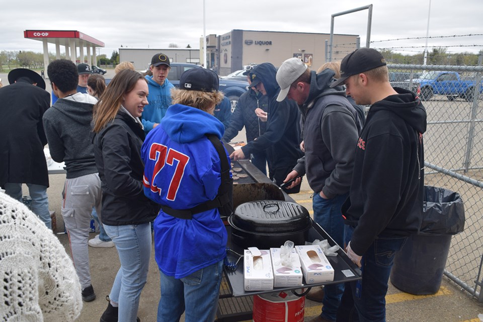 The weather was chilly but the atmosphere was warm and friendly for the Canora Composite School Grad barbecue fundraiser on May 18, as many local residents stopped by for burgers and to support the grads.