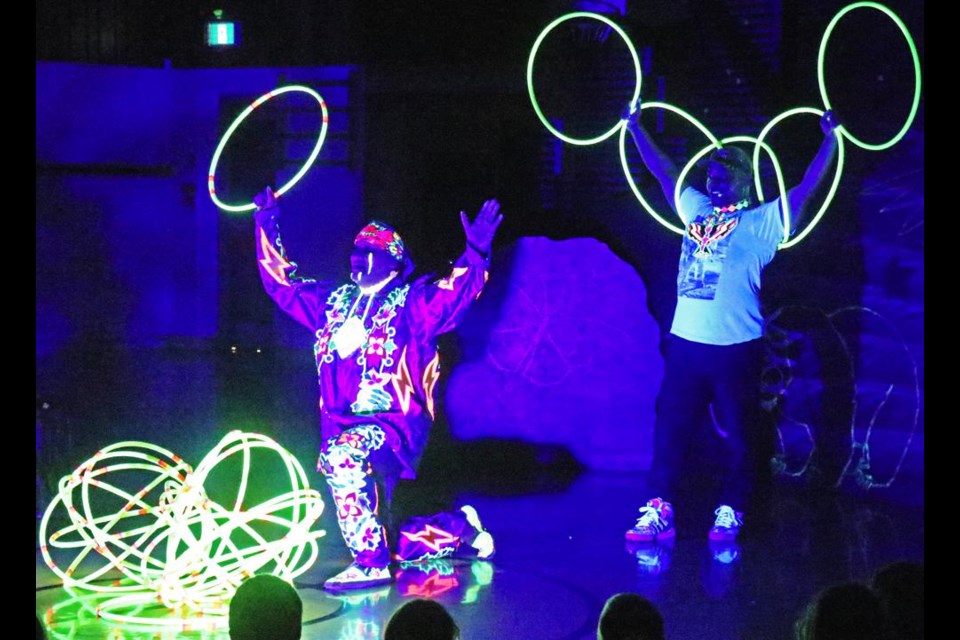 Hoops dancer Terrance Littletent and hip-hop dancer Chancz Perry did the finale of an eagle dance using black light, during a performance for the students of Assiniboia Park School on Tuesday.