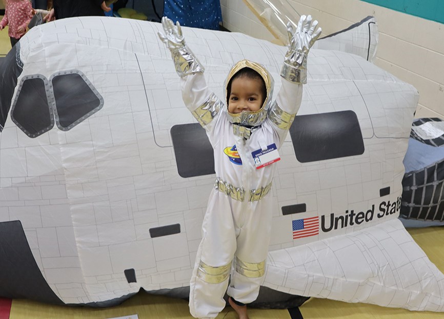 At the Air Fort/Space Rover station, Zayda Slowski got to dress up like an astronaut and pretend that she was on a space exploration mission.