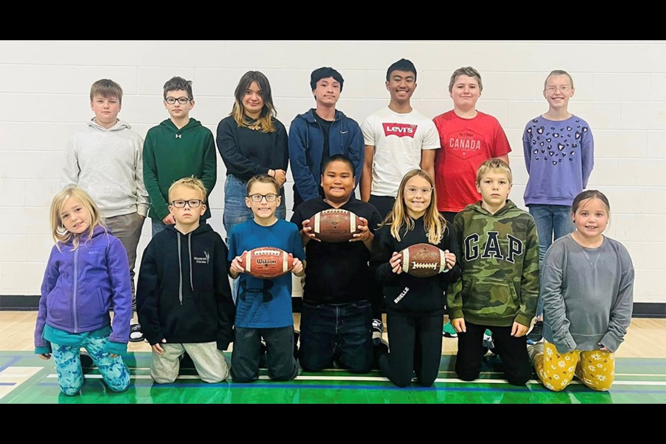 Invermay students who competed in the Pass, Punt and Kick competition, from left, were: (back row) Bennett Carlson, Weston Glas, Caidence Keller, Angelo Ferenal, Michael Mesias, Kashton MacLean and Hanna Enge; and (front) Rhianna Graham, Lincoln Keller, Karson Enge, Perseus Mesias, Brielle Enge, Morgan Graham and Krystal Oie.
