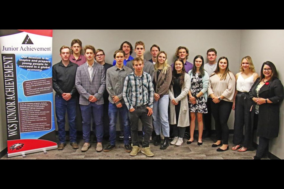 The Entrepreneurship 30 class gathered prior to a board meeting for their student company, In The Moment Clothing Co., from the Weyburn Comp School.