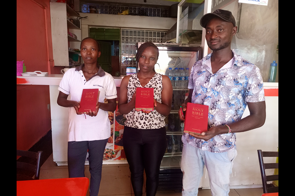 Vic Hamer of Elkhart, Illinois, President of Give Me Water Lord, a not for profit organization based in Elkhart,  reports that the group recently presented Bibles in Kenya to Veronica, Lydia and Michael (pictured). Veronica is from Nakurua and owns a hotel near Nairobi called Eve's Dinner Hotel. Lydia is Veronica's employee from Meru and Michael is a customer from Machakos. Hamer, who enjoys his time at Burgis Beach in the summer, first started doing volunteer work in Kenya in 2010. GMWL works to bring fresh water and other life-changing resource to the needy in Kenya.