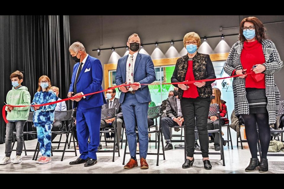The dignitaries lined up to cut the ribbon to officially open Legacy Park Elementary School on Wednesday, including Mayor Marcel Roy, Education minister Dustin Duncan, board chair Audrey Trombley, and Lynn Little, director of education for Cornerstone.