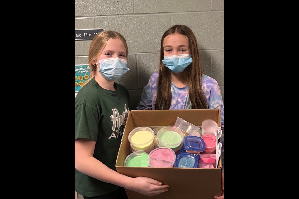 Logan Gerein and Natalie Bertoia pose with their product that was part of the St. Peter's Genius Hour Project. 