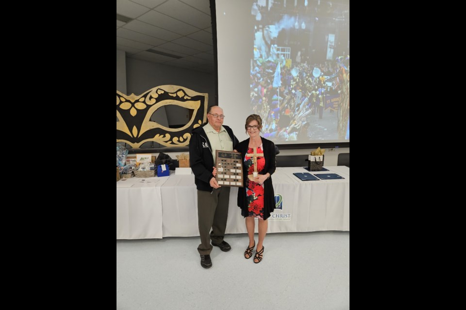 A special celebration held by Light of Christ Catholic School Division included a special award presented to retired St. Peter's School teacher  Nadine Keller.