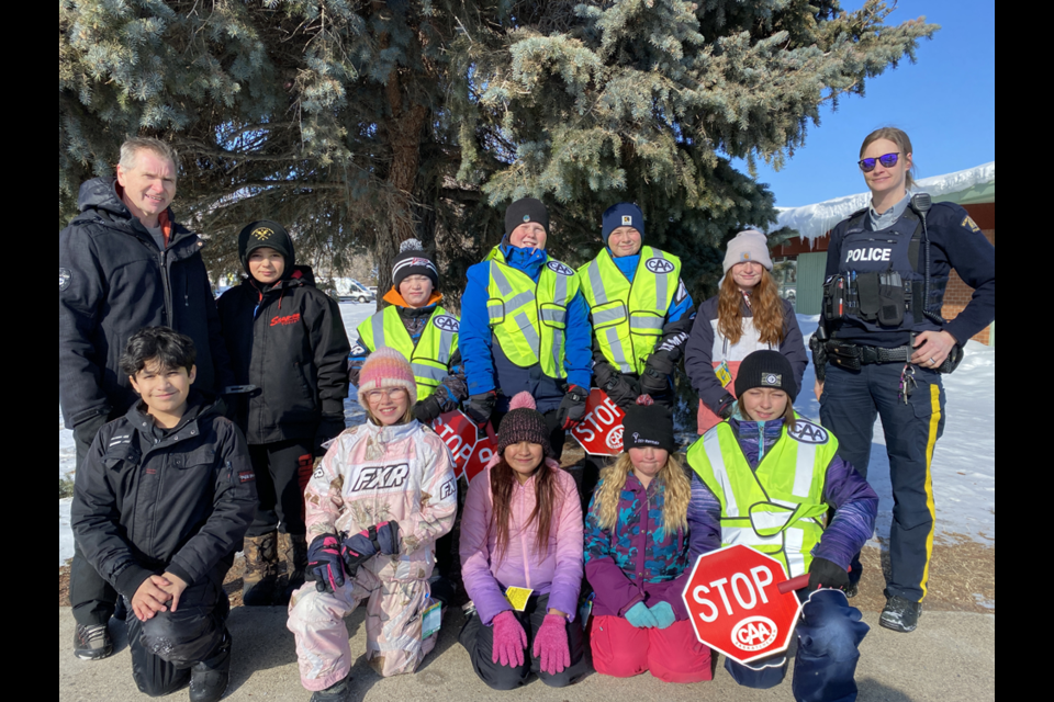 On Feb. 27, these 10 Grade 5 students at CCS completed the CAA safety patrol program, and then started their patrols. From left, were: (standing) Principal Kim Eiteneier, Gabby Ball, Camryn Burym, Seth Propp, Chance Weinbender, Rachel Mentanko and RCMP Cst. Baily Potts; and (kneeling) Raphael Rollin, Mykelti Johnstone, Arriyah Cree, Aubrey Wilson and Maggie Lemaigre. 
