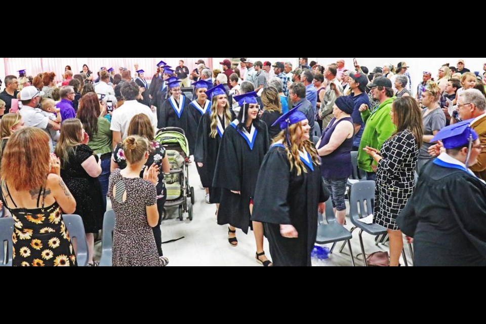 The audience of friends and families cheered and applauded as the graduates entered McKenna Hall for the grad ceremonies of 鶹ýAVeast College on Friday