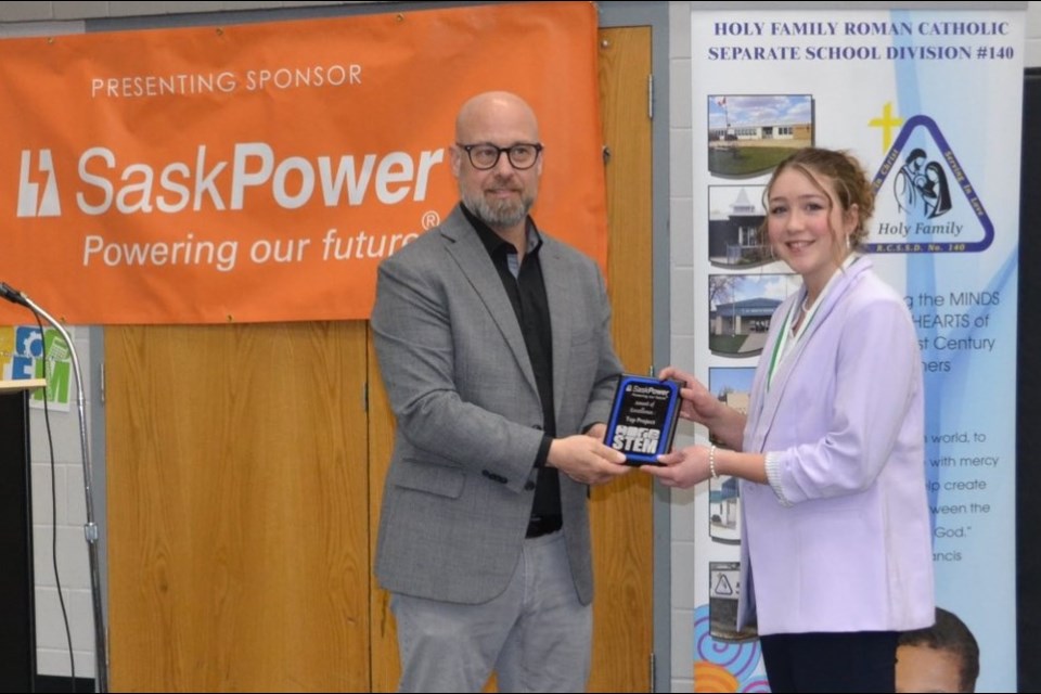 Chad Fingler presents top prize to Amy Fradette.