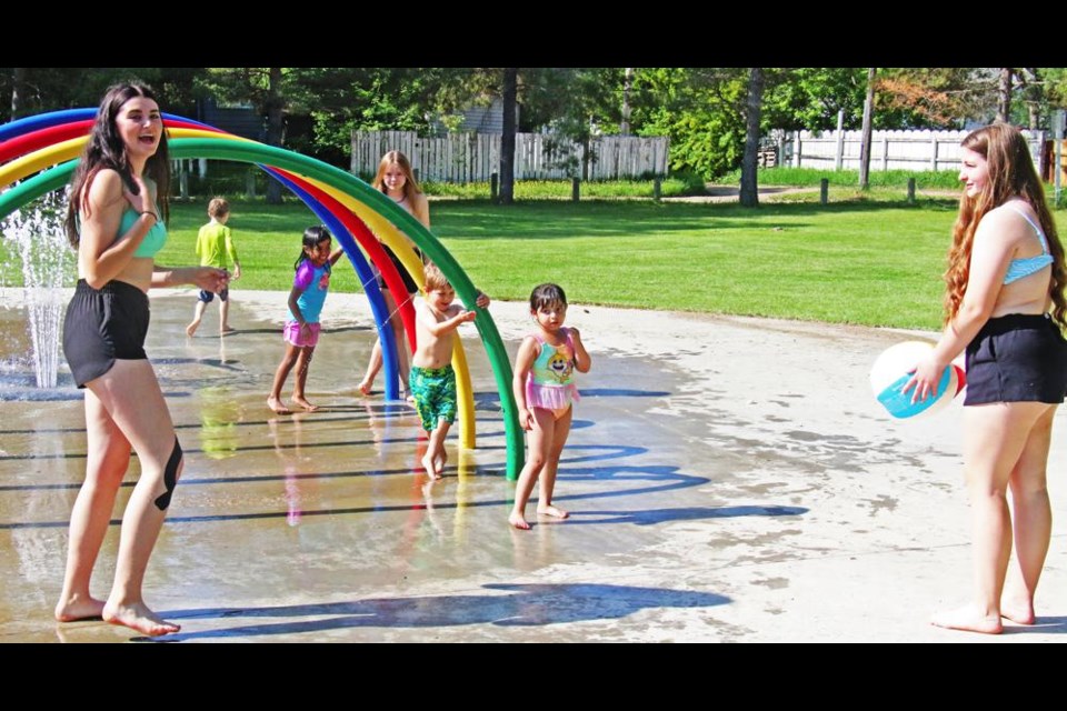 The Pre-K class and Grade 9 buddies enjoyed the warm sun on Wednesday at the Young Fellows spray park.