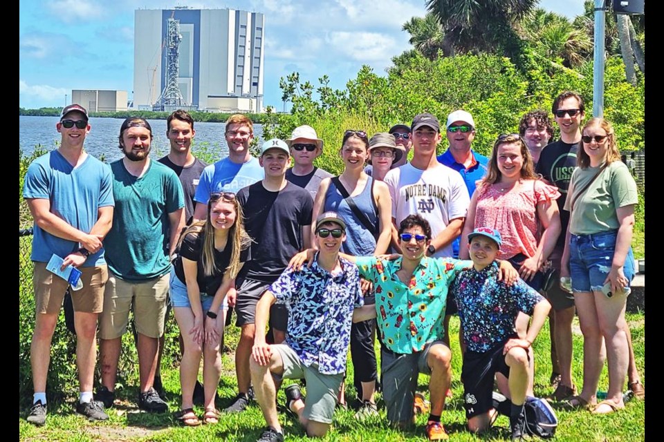The USask teams gathered with the Kennedy Space Center in the background, as they were in Florida to watch the launch of the SpaceX rocket carrying their cube satellite up to the Int'l Space Station on Monday.