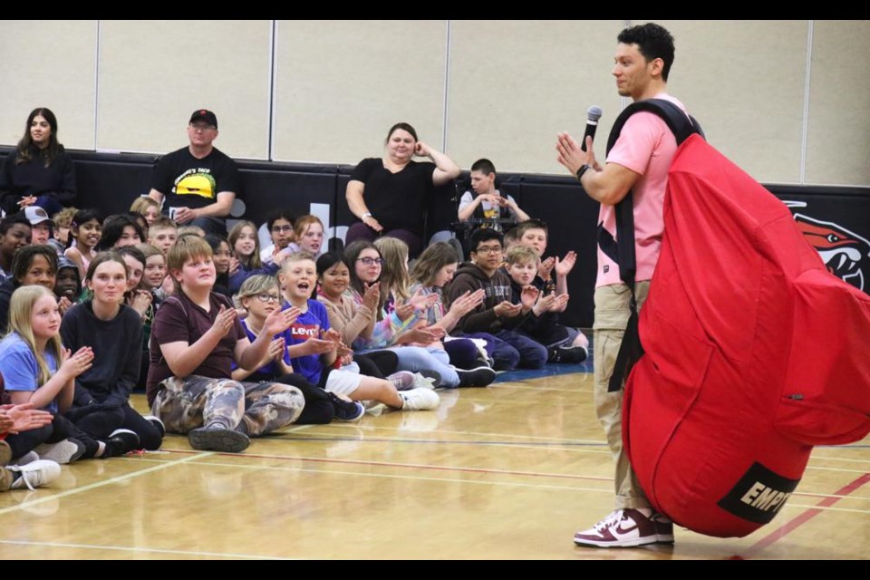 Sam Demma, a motivational speaker on a cross-Canada tour, used an oversized backpack to make a point with the students at St. Michael School on Friday.