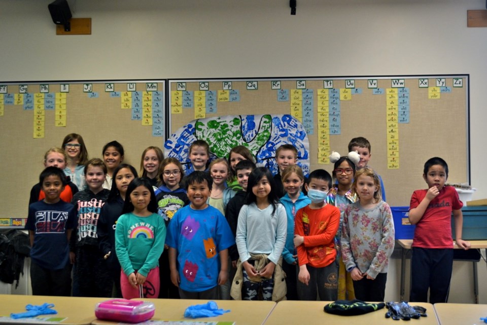 St. Mary's School Grade 2/3 students marked Earth Day by taking care of their own community. 
