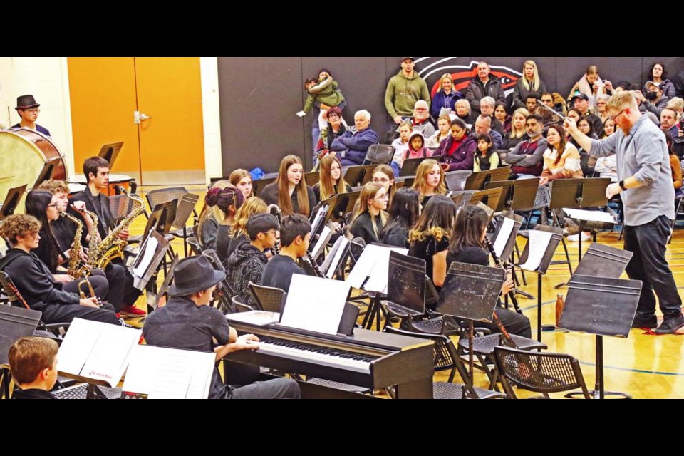 The Grade 9 band, under the direction of Jeff Lunde at right, played three songs to start off the Winter Band Showcase on Wednesday evening, then the band combined with Grade 8 for the Honour band performance.