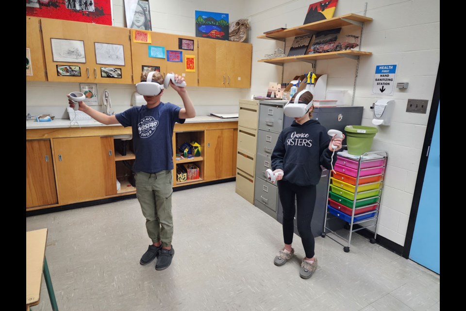 UCHS students Dayne Rusk and Tinsley Leclerc, both in Grade 7, experience class with virtual reality technology.