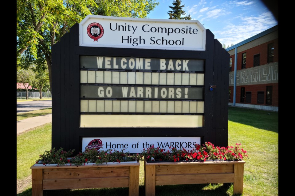 School spirit is evident in this UCHS sign as well as planters that include Warrior colors.  