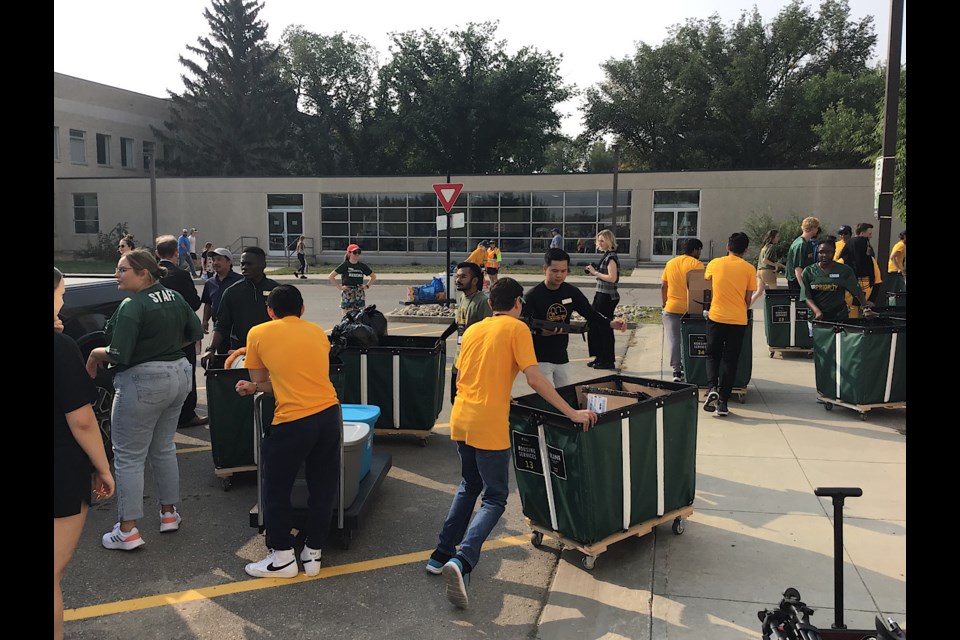 Students new to the dorms at the University of Regina got a lot of help moving in Monday.