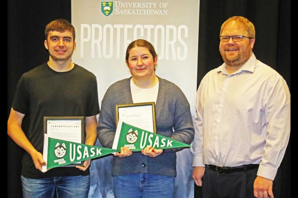 Weyburn Comp Grade 12 students Dalton Molnar and Gracyn Knipfel were awarded with prestigious full scholarships for the University of Saskatchewan on Monday, and were congratulated by principal Ryan Fowler. Dalton was presented wtih the George and Marsha Ivany President’s First and Best Scholarship, worth $40,000 over four years, while Gracyn won the Chancellor’s Entrance Scholarship worth $24,000 over four years.