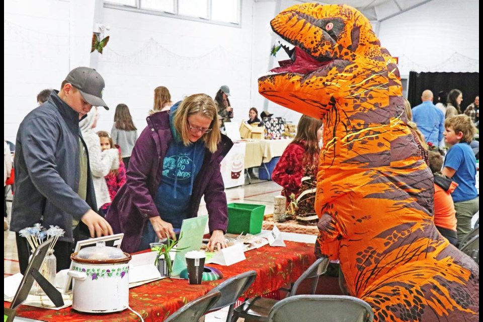 A dino was spotted at the "Wild and Free" market on Wednesday, where home-schooling families showcased the crafts, baking and other projects the kids have been working on.