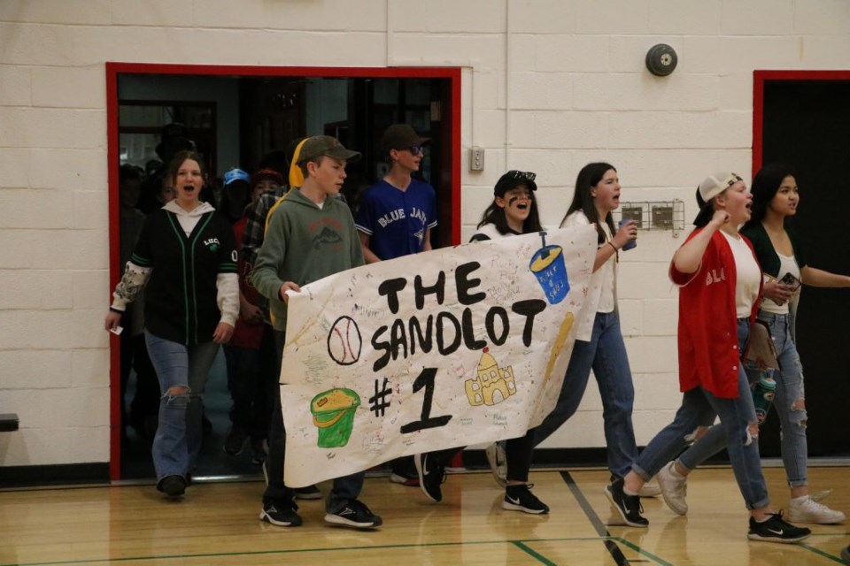 The winning team for UCHS junior high Snolympics enjoy their energetic march into the gymnasium at the event's start.