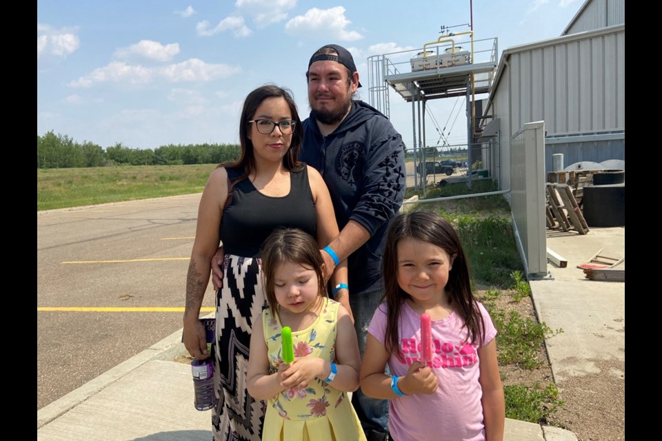 Evacuees Carmen Charles, back left, with her partner Donovan Sanderson, and children Willow, front left, and Abby, front right.