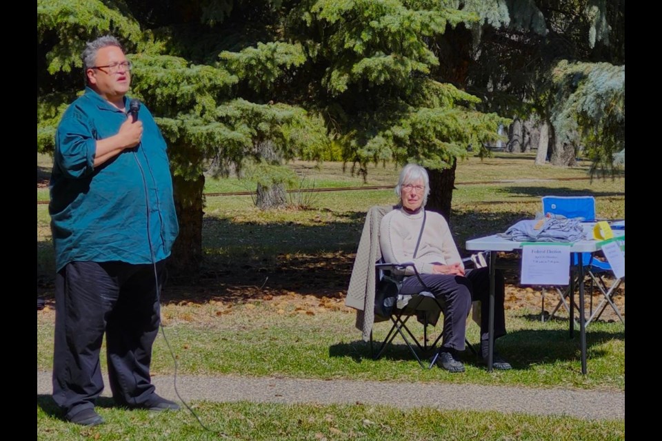Christopher Shavetail shares his experience as a former oil and gas worker during the Earth Day Action rally on Saturday, April 26, at Kinsmen Park.