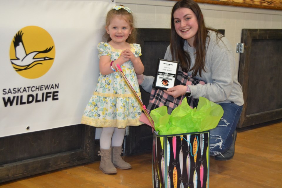 Emerly Sliva, left, who was only two years old, received the John Pantiuk Memorial Award for youngest angler at the Preeceville Wildlife annual banquet and awards. Lexi Prouse made the presentation.