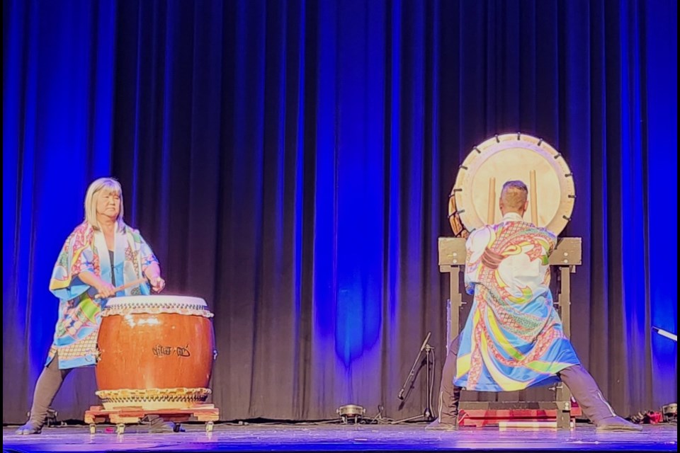 Living Sky Taiko drum group members perform during the Rhythm & Roots festival.