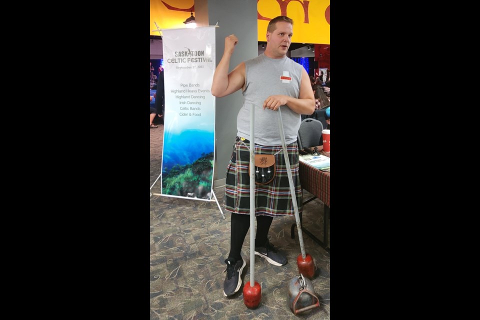 Karl Hren holds the hammer that will be used in one of the throwing events.