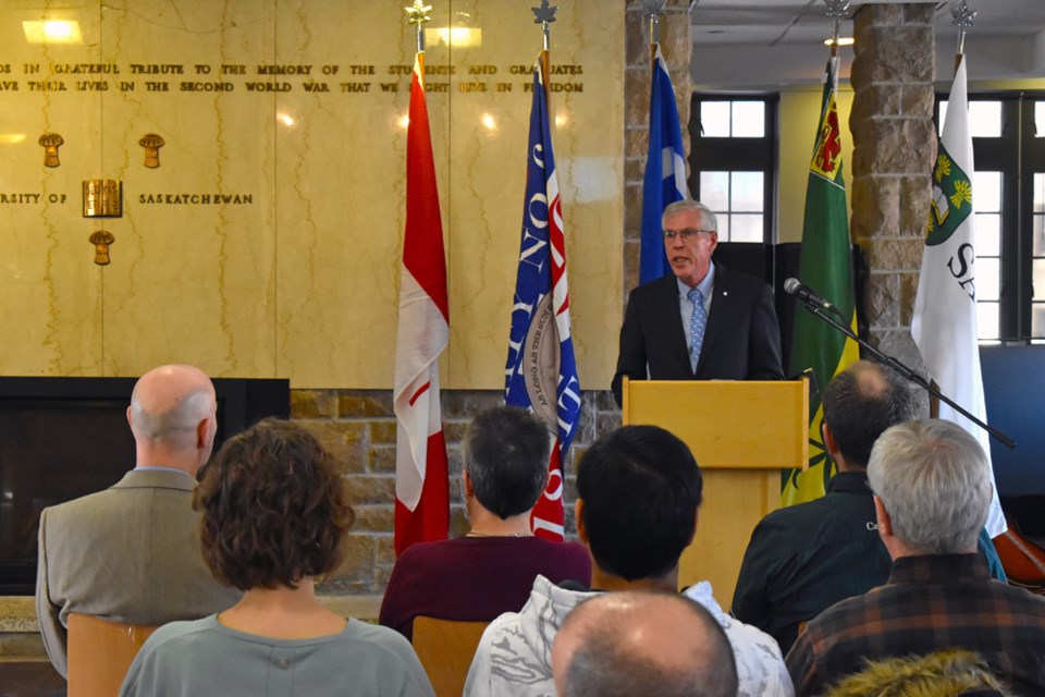 Historic Sites and Monuments Board of Canada Saskatchewan Representative Bill Waiser addresses the crowd on the significance of the ceremony on Wednesday.