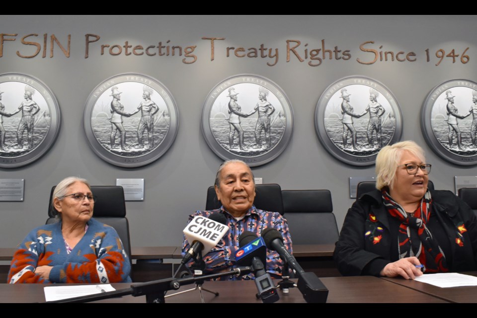 Doug Morningchild answers questions from the media while his wife Flora and Federation of Sovereign Indigenous Nations Fourth Vice Chief Heather Bear look on.