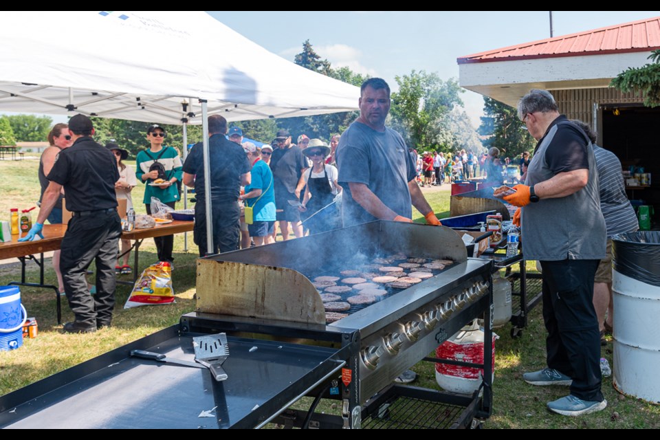 There was a continual long line of people for the barbecue offerings that were part of North Battleford's Canada Day celebration. The cooks were hot but kept the food coming.