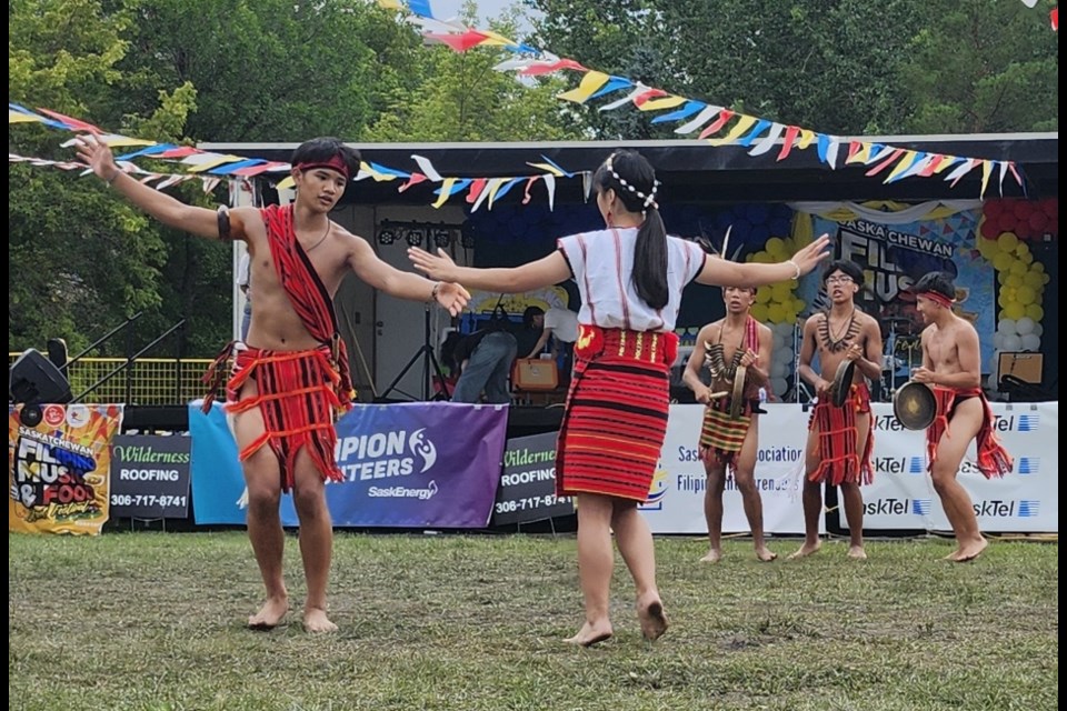 Members of the Philippine Cordillerans of Saskatoon perform a traditional courtship dance on the last day of the Saskatchewan Filipino Food and Music Festival on Sunday, Aug. 10, at the Kinsmen Park. 