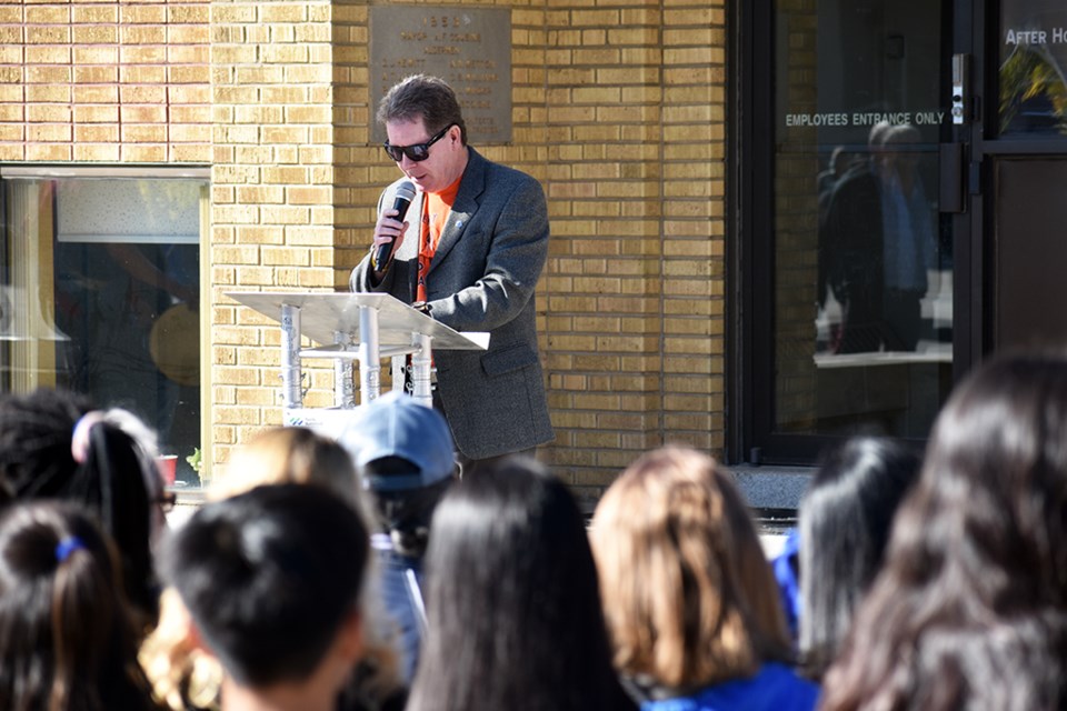 Mayor David Gillan shares comments about the importance of working together during the onset of a week honouring the upcoming National Day of Truth and Reconciliation in North Battleford above a sea of school children who came to watch the event. 