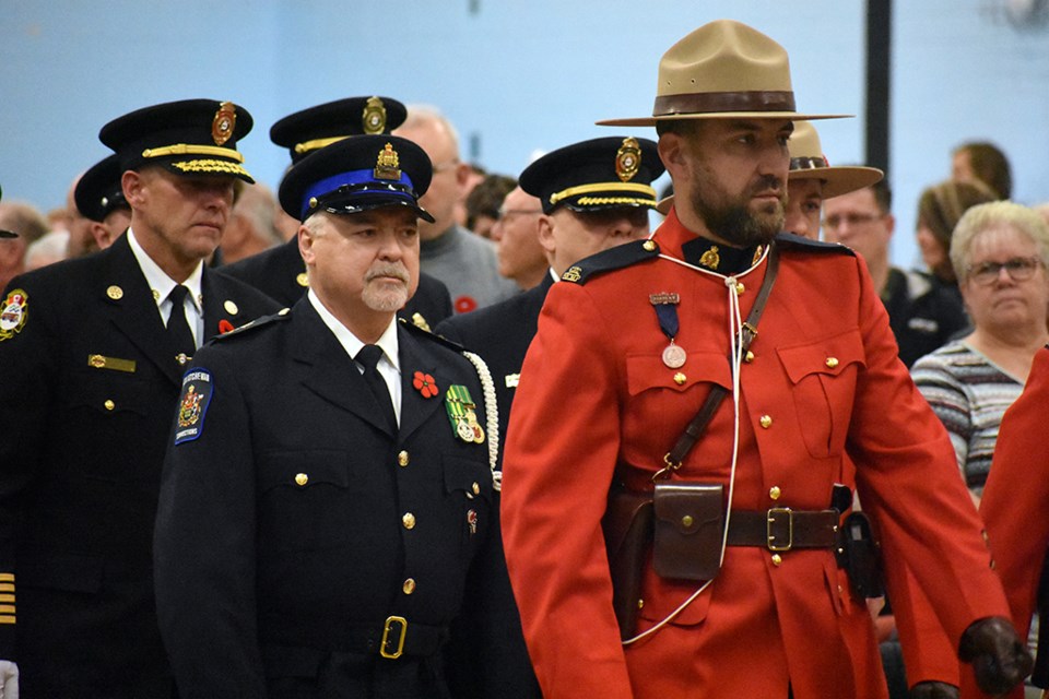 The RCMP and members of the North Battleford Fire Department enter at the start of the ceremony on Nov. 11 in the Don Ross Centre.
