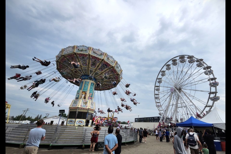 The Wave Swinger and Century Wheel were among the rides that drew long lines.