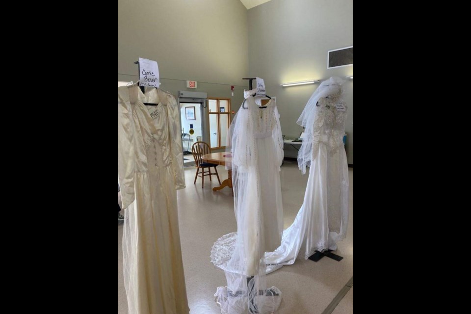 Three generations of wedding gowns from Carrie Boser were on display at Parkview Place Valentine's Day event .