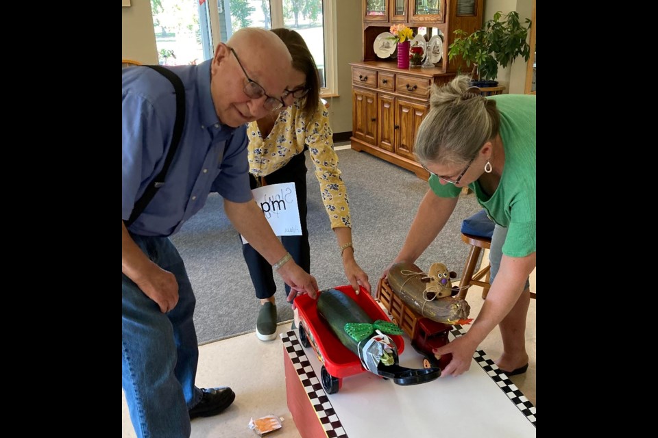 Parkview Place resident, Adam Tuscherer, readies his entry with help of his pit crew as part of the Zucchini 500 races Sept. 10.