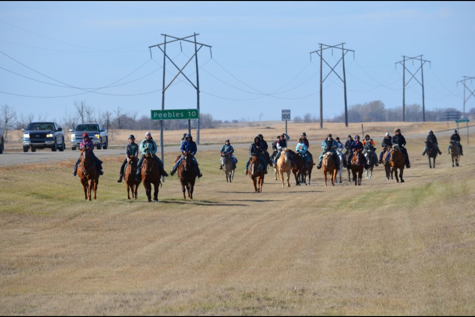 More than 25 people of all ages rode their horses into Windthorst and down Main Street, stopping at Norm’s Place where the luncheon was held. 

