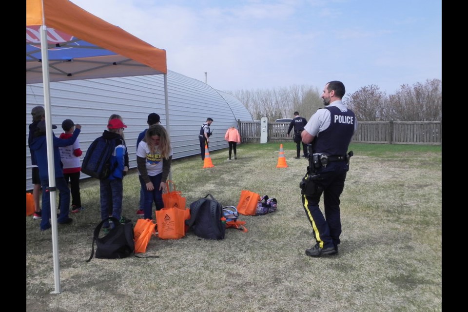 Members of Unity RCMP had kids participate in activities as part of their educational safety message that was one of the 12 stations set up for Unity's Ag-Ed Day.
