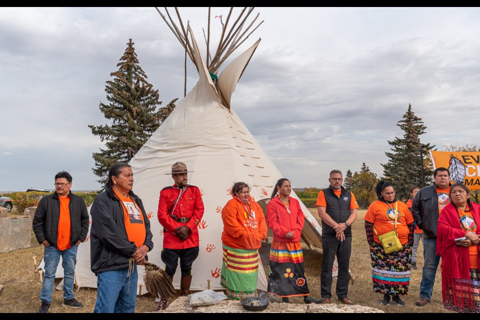 Dignitaries in front of the teepee.