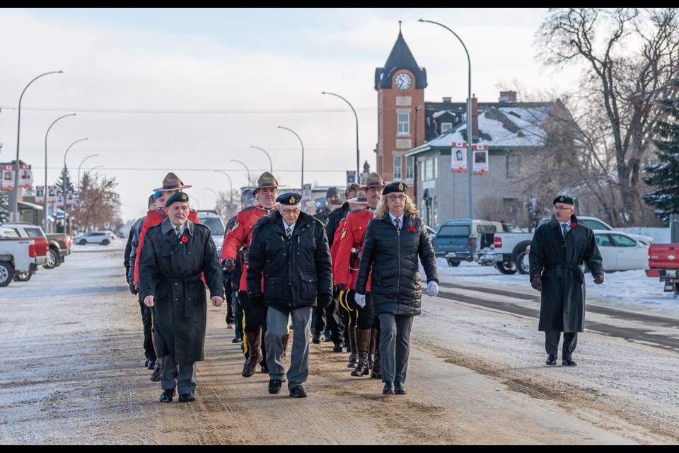 Legion members, RCMP members and Scouting members parade down 22nd Street in Battleford to St Vital School for the Remembrance Day Service.